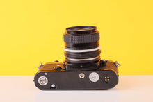 Load image into Gallery viewer, Nikon FE Black 35mm Film Camera with Nikon 35mm f/2.8 Lens
