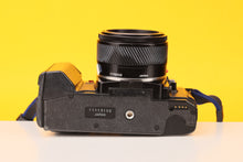 Load image into Gallery viewer, Minolta 7000 35mm SLR Film Camera with Minolta 50mm f1.7 Lens
