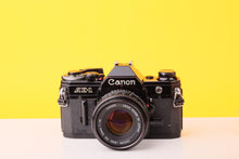 Load image into Gallery viewer, Canon AE-1 Black 35mm SLR Film Camera With 50mm F/1.8 Prime Lens
