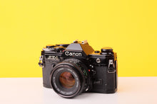 Load image into Gallery viewer, Canon AE-1 Black 35mm SLR Film Camera With 50mm F/1.8 Prime Lens
