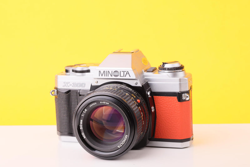 Minolta X-300 35mm Film Camera with Minolta MD 50mm f1.4 Lens in Orange