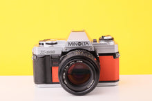 Load image into Gallery viewer, Minolta X-300 35mm Film Camera with Minolta MD 50mm f1.4 Lens in Orange
