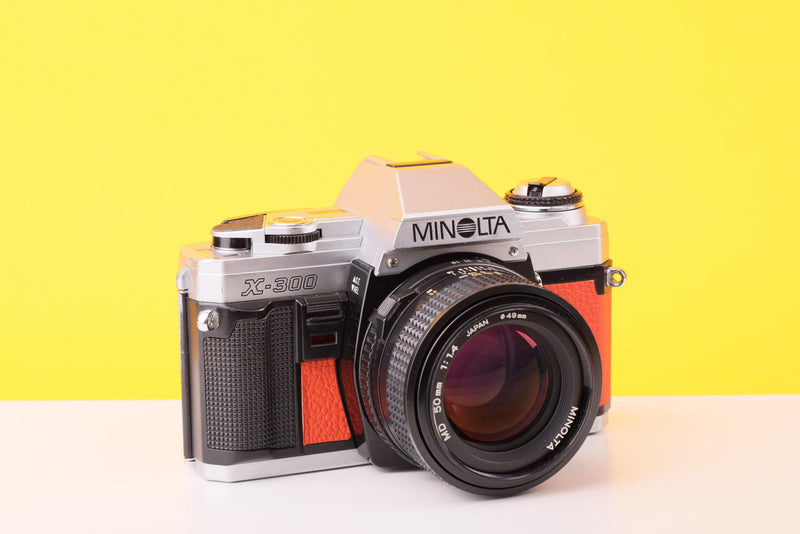 Minolta X-300 35mm Film Camera with Minolta MD 50mm f1.4 Lens in Orange