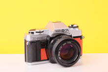Load image into Gallery viewer, Minolta X-300 35mm Film Camera with Minolta MD 50mm f1.4 Lens in Orange
