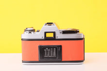 Load image into Gallery viewer, Minolta X-300 35mm Film Camera with Minolta MD 50mm f1.4 Lens in Orange
