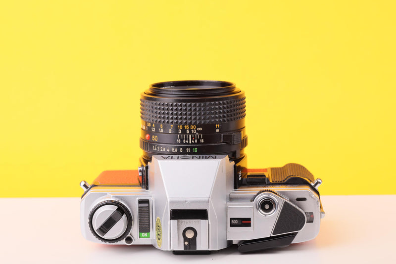 Minolta X-300 35mm Film Camera with Minolta MD 50mm f1.4 Lens in Orange