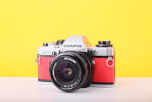 Load image into Gallery viewer, Olympus OM10 35mm SLR Film Camera with Miranda 28mm f/2.8 Lens in Scarlet Red
