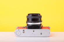 Load image into Gallery viewer, Olympus OM10 35mm SLR Film Camera with Miranda 28mm f/2.8 Lens in Scarlet Red

