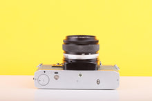 Load image into Gallery viewer, Olympus OM10 35mm Film Camera with Zuiko 50mm f1.8 Prime Lens Safari Green
