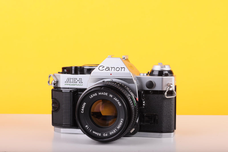 Canon AE-1 Program 35mm SLR Film Camera with Canon FD 50mm f/1.8 Lens – Boxed
