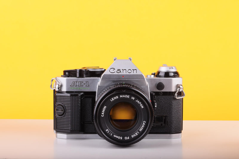 Canon AE-1 Program 35mm SLR Film Camera with Canon FD 50mm f/1.8 Lens – Boxed