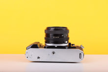 Load image into Gallery viewer, Canon AE-1 Program 35mm SLR Film Camera with Canon FD 50mm f/1.8 Lens – Boxed
