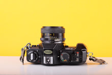 Load image into Gallery viewer, Nikon F-301 35mm SLR Film Camera with Bell &amp; Howell 24mm f/2.8 Lens
