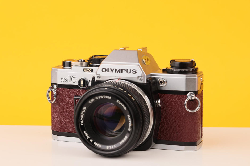 Olympus OM10 35mm Film Camera with Zuiko 50mm f1.8 Prime Lens Burgundi