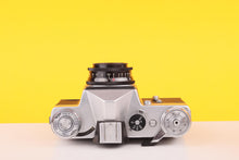 Load image into Gallery viewer, Zenit EM Silver 35mm Film Camera with Industar 50mm f/2 Lens
