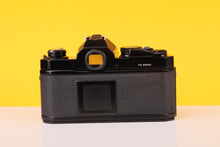 Load image into Gallery viewer, Nikon FM Black 35mm Film Camera with Nikon Nikkor 50mm f/1.8 Lens
