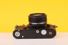 Load image into Gallery viewer, Nikon FM Black 35mm Film Camera with Nikon Nikkor 50mm f/1.8 Lens
