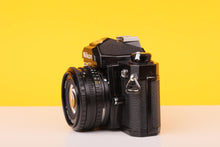 Load image into Gallery viewer, Nikon FM Black 35mm Film Camera with Nikon Nikkor 50mm f/1.8 Lens
