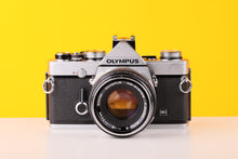 Load image into Gallery viewer, Olympus OM-1n 35mm SLR Film Camera with Zuiko 50mm f1.8 Lens
