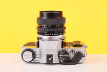 Load image into Gallery viewer, Olympus OM20 35mm SLR Film Camera with Zuiko 35-70mm f/3.5 Lens
