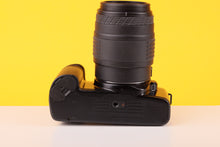 Load image into Gallery viewer, Canon EOS 1000Fn 35mm SLR Film Camera with Sigma 70-210mm Lens
