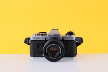 Load image into Gallery viewer, Fujica AX-1 35mm SLR Film Camera with X-Fujinon 55mm F/2.2 Lens
