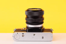 Load image into Gallery viewer, Olympus OM10 35mm SLR Film Camera with Olympus OM-System S Zuiko Auto-Zoom 28-48mm f4 Lens

