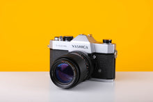 Load image into Gallery viewer, Yashica TL Electro 35mm SLR Film Camera with a Carl Zeiss MC 135mm f3.5 Lens
