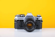 Load image into Gallery viewer, Canon AE-1 35mm SLR Film Camera with 50mm f1.8 lens
