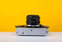 Load image into Gallery viewer, Canon AE-1 35mm SLR Film Camera with 50mm f1.8 lens
