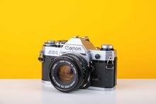 Load image into Gallery viewer, Canon AE-1 35mm SLR Film Camera with 50mm f1.8 lens
