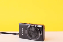 Load image into Gallery viewer, Canon digital camera on a yellow background
