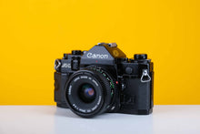 Load image into Gallery viewer, Canon A-1 Vintage SLR 35mm Film Camera with Canon FD 28mm f/2.8 Lens
