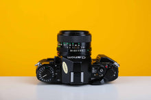 Load image into Gallery viewer, Canon A-1 Vintage SLR 35mm Film Camera with Canon FD 28mm f/2.8 Lens
