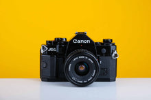 Load image into Gallery viewer, Canon A-1 Vintage SLR 35mm Film Camera with Canon FD 28mm f/2.8 Lens
