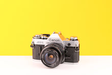 Load image into Gallery viewer, Canon AE-1 35mm SLR Film Camera with Vivitar 28mm f2.8 MC Wide Angle Lens
