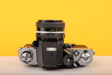 Load image into Gallery viewer, Nikon F2 35mm Film Camera with Nikon 50mm f1.8 Prime Lens
