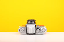 Load image into Gallery viewer, Edixa Flex 35mm SLR Film Camera in Red with Leather Case
