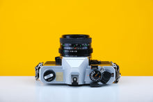 Load image into Gallery viewer, Fujica STX-1N 35mm SLR Film Camera with Tefnon f2.8 28mm Lens
