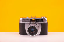 Load image into Gallery viewer, Halina Paullette Electric 35mm Camera with Halinar 45mm f2.8 Lens
