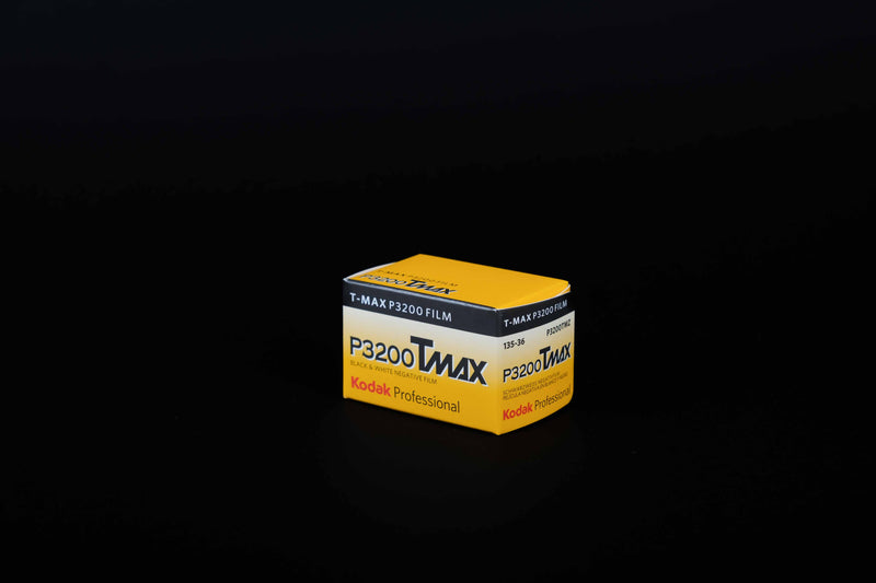 A box of Kodak P3200 Tmax Black and White 35mm film against a black background.