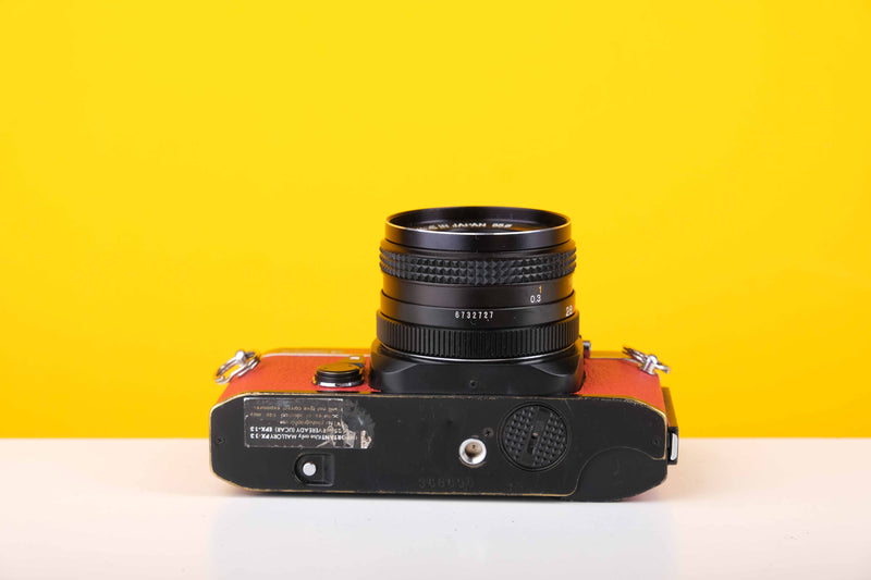 Konica Autoreflex TC 35mm SLR Film Camera with Konica Hexanon AR 28mm f3.5 Prime Lens in Red