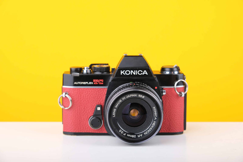 Konica Autoreflex TC 35mm SLR Film Camera with Konica Hexanon AR 28mm f3.5 Prime Lens in Red