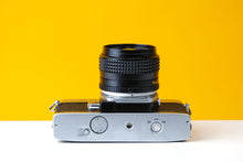 Load image into Gallery viewer, Minolta SrT303 35mm SLR Film Camera with Minolta 50mm f1.4 Lens
