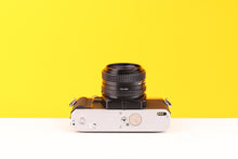 Load image into Gallery viewer, Minolta X-300 35mm Film Camera with Minolta MD 50mm f2 Lens
