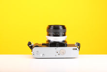 Load image into Gallery viewer, Minolta x-300 SLR 35mm Film Camera with Vivitar/Hoya HMC Wide-Auto 28mm f2.8 Lens
