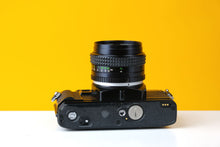 Load image into Gallery viewer, Minolta X-300 35mm Film Camera with Minolta 50mm f/1.7 Lens
