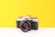 Load image into Gallery viewer, Minolta X-300 35mm Film Camera with Minolta MD 50mm f2 Lens
