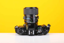Load image into Gallery viewer, Minolta X-700 35mm SLR Film Camera with Minolta MD 35-70mm f3.5 Lens
