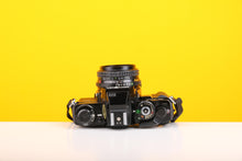 Load image into Gallery viewer, Minolta X-700 35mm Film SLR Camera with Minolta MD Rokkor 45mm f/2 Lens
